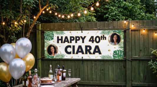 Personalised 6x2ft PVC birthday banner cable-tied to a garden fence (example design)