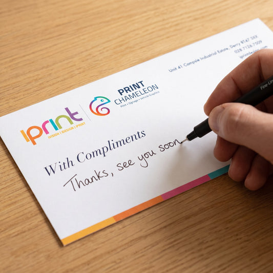 Handwritten note on an uncoated DL compliment slip