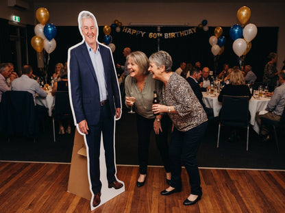 Life-size cut-out of a man in a suit at a 60th birthday party (example design)