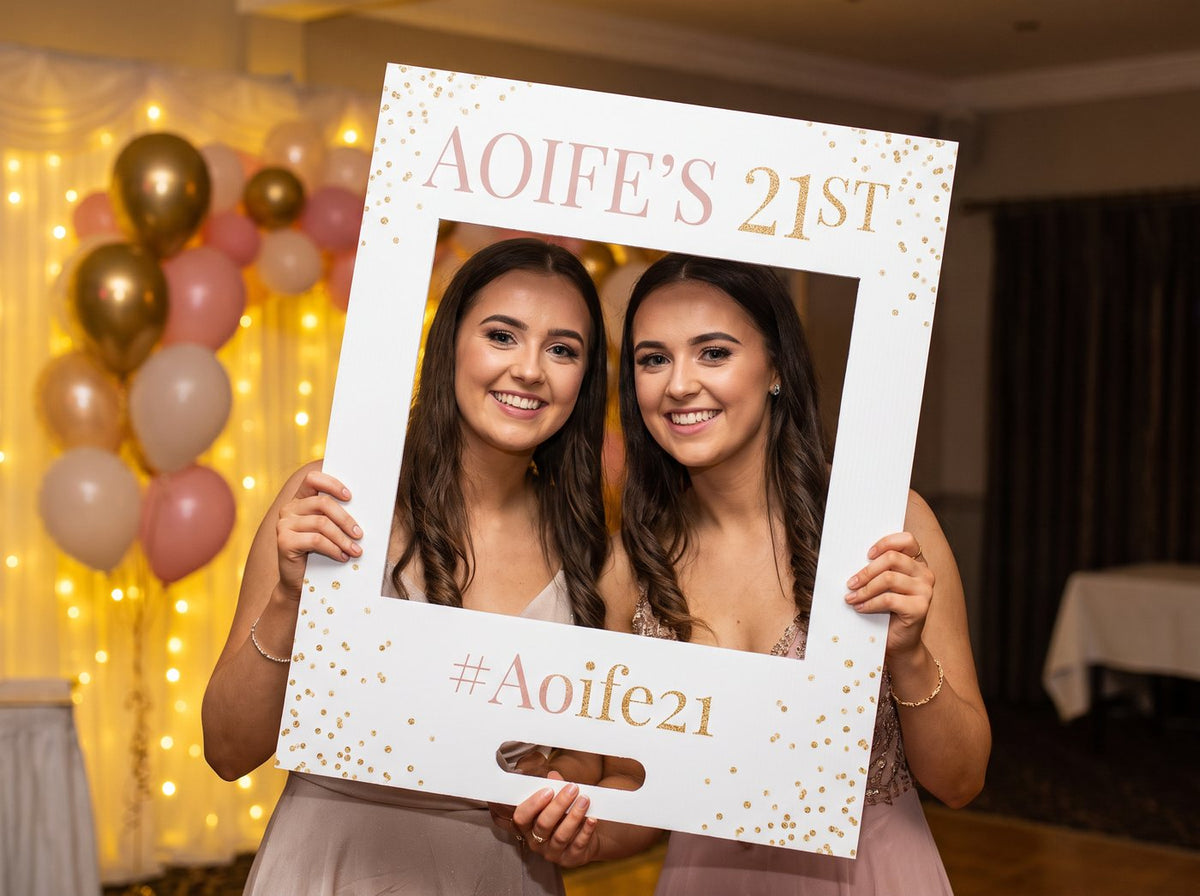 Two friends holding a personalised A1 foamex selfie frame for a 21st (example design)